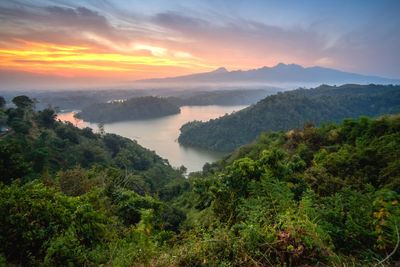 Scenic view of mountains against sky at sunset