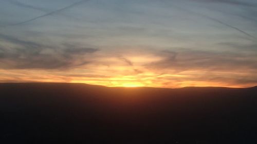 Scenic view of dramatic sky during sunset