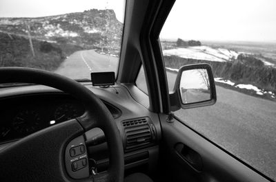 Cropped image of car on road