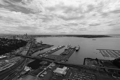 High angle view of harbor against cloudy sky