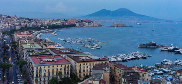 High angle view of harbor and buildings in city