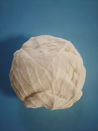 High angle view of bread against blue background