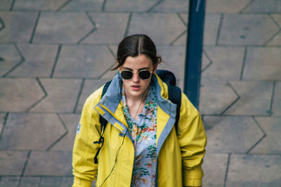 Portrait of woman wearing sunglasses standing outdoors