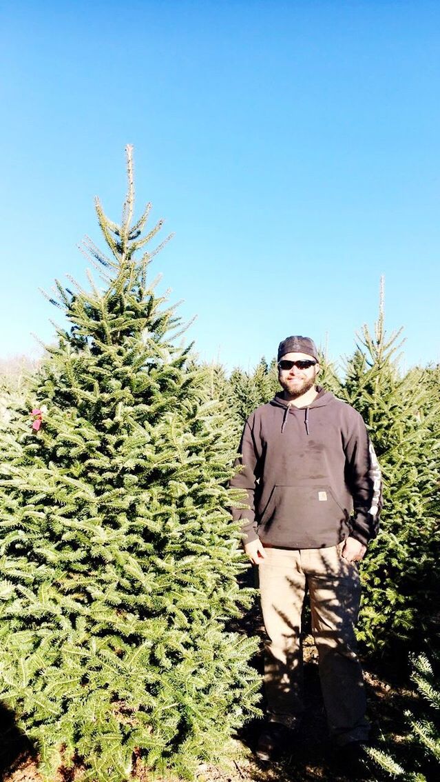 only men, one person, tree, one man only, adults only, christmas, archival, senior adult, people, standing, adult, outdoors, day