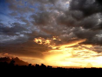 Scenic view of landscape against cloudy sky