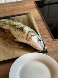High angle view of fish in plate on table