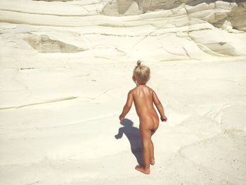 Full length of woman standing on beach