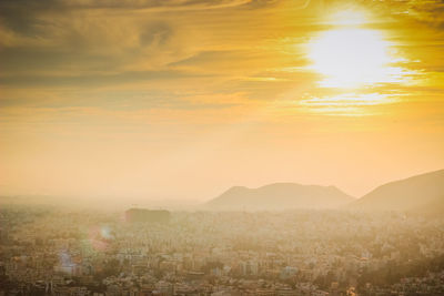 High angle view of city during sunset