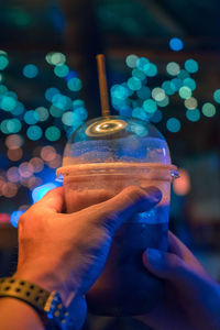 Close-up of hand holding drink