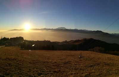 Scenic view of landscape against sky during sunset