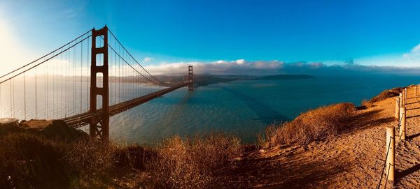 View of suspension bridge over sea