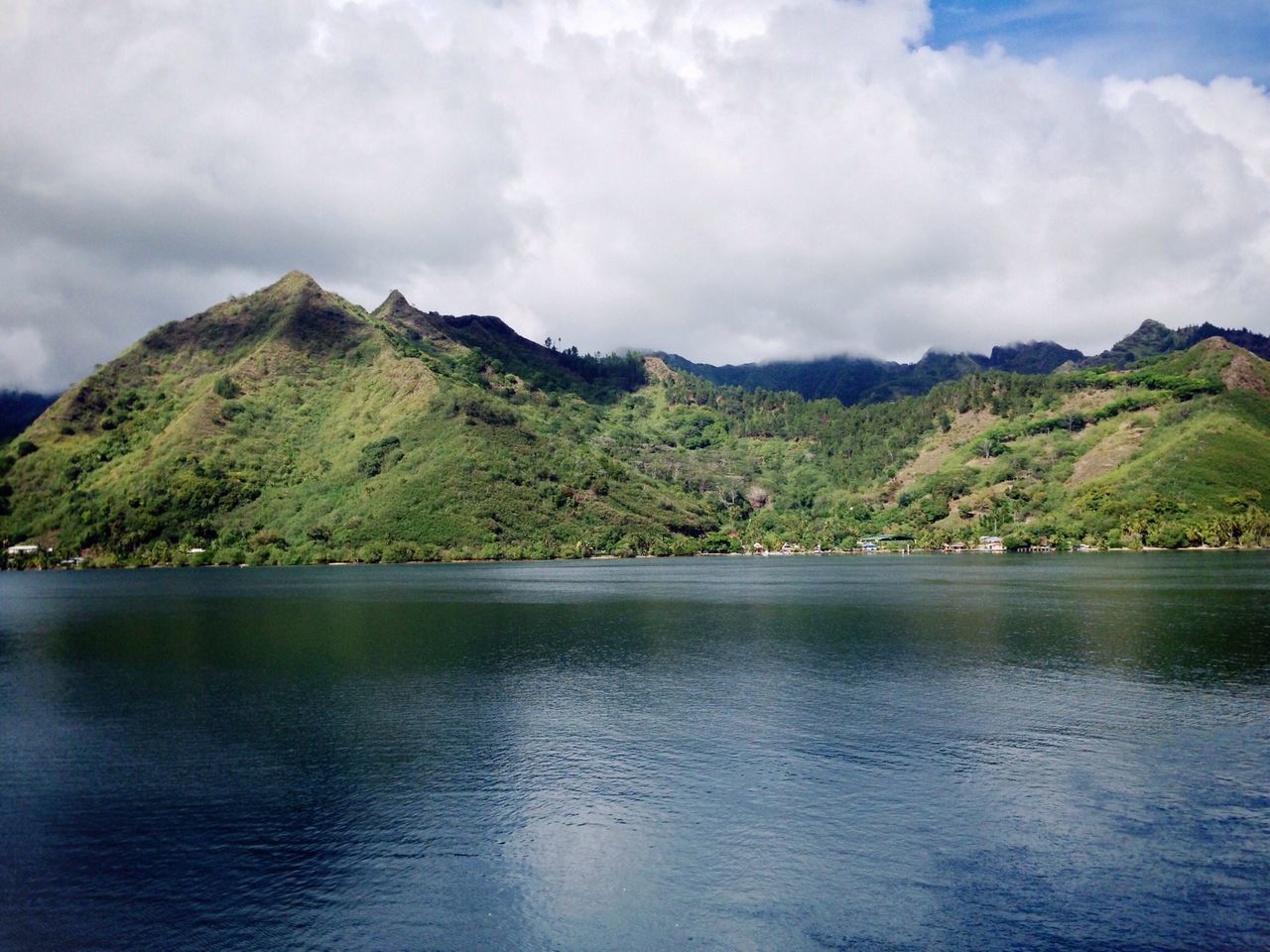 mountain, water, tranquil scene, sky, scenics, waterfront, tranquility, beauty in nature, lake, mountain range, cloud - sky, nature, cloudy, cloud, tree, idyllic, non-urban scene, river, day, green color