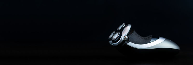 High angle view of shoes on table against black background