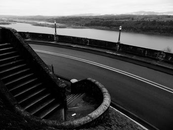 High angle view of road by mountain against sky