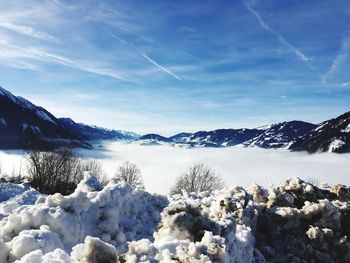 Scenic view of snow covered mountains against sky