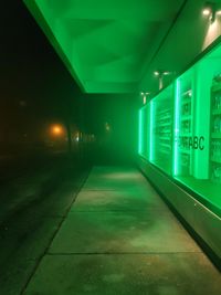Illuminated light trails on building at night