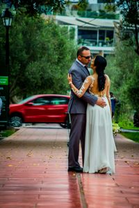 Rear view of couple sitting on floor