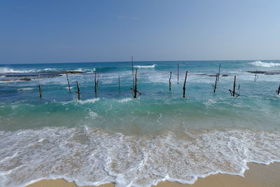 Scenic view of sea against clear blue sky