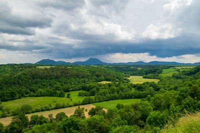 View of the chain of auvergne volcanoes under a thunderstorm