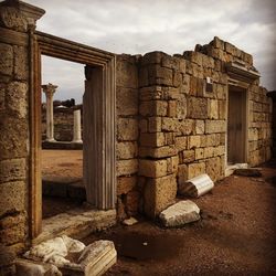 View of old ruin building against cloudy sky