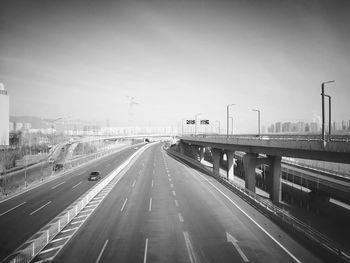 Highway against sky in city