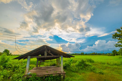 Built structure on field against sky