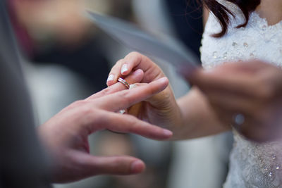 Close-up of couple holding hands