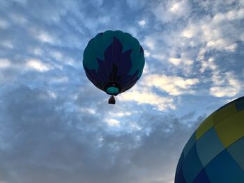 Low angle view of hot air balloons against sky