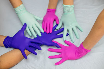 High angle view of woman with pink hands