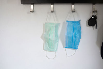 Close-up of clothes hanging over white background