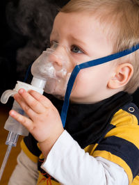 Portrait of boy drinking coffee
