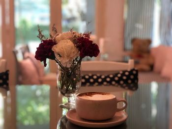 Close-up of flower vase on table