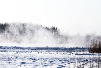 Cars racing on the frozen lake. drifting cars on ice. fun sport in winter.