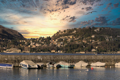 Scenic view of bay against sky at sunset