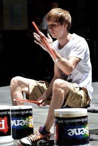 Full length of a man sitting on floor