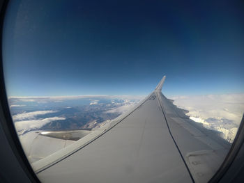 Aerial view of sky seen through airplane window