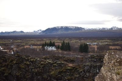 Scenic view of landscape and mountains against sky
