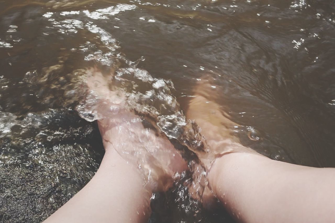 water, low section, person, personal perspective, lifestyles, barefoot, leisure activity, human foot, high angle view, part of, wet, sunlight, relaxation, day, outdoors, rippled