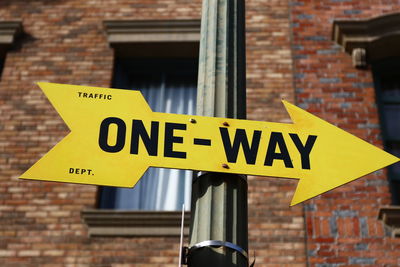 Low angle view of sign against building