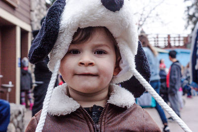 Portrait of cute boy wearing hat during winter