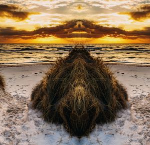 Digital composite image of beach against sky during sunset