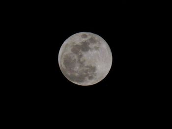 Low angle view of moon against clear sky at night