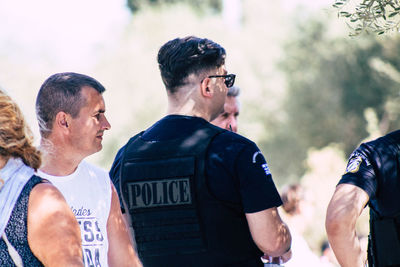 Group of people standing against blurred background