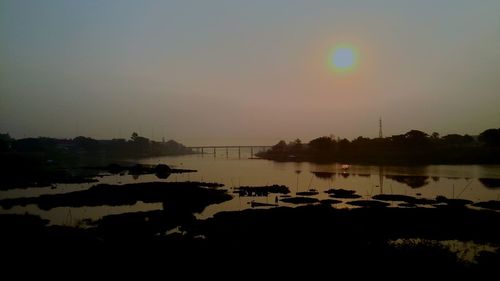 Scenic view of lake at sunset