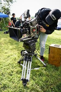 Man photographing on field