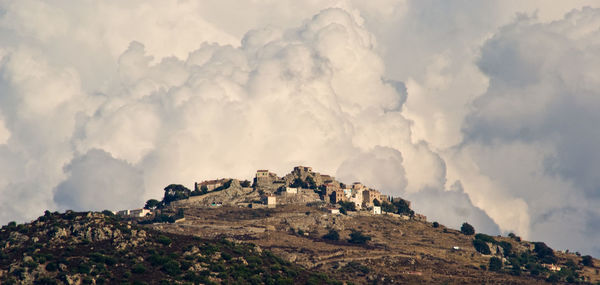 Panoramic view of rocks on land against sky