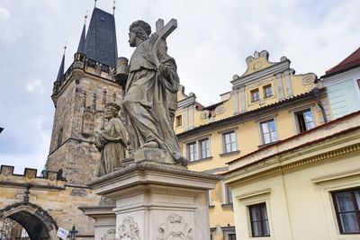 Low angle view of statue against building