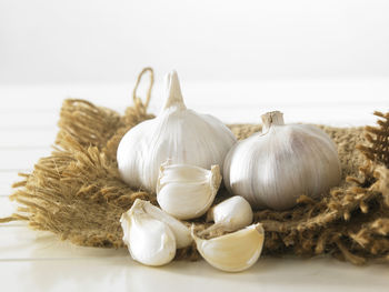 Close-up of garlic on burlap