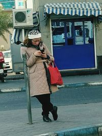 Woman with umbrella in winter