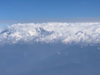 Scenic view of snowcapped mountains against sky